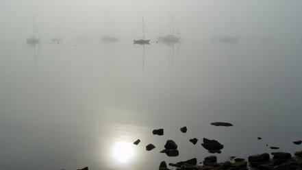 Water rocks fog boats reflections wallpaper