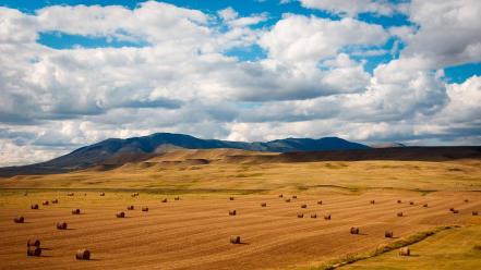 Mountains clouds landscapes fields hay wallpaper