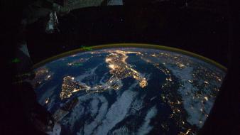 Earth city lights clouds outer space wallpaper