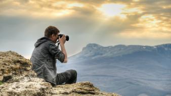Sun cameras clouds men mountains wallpaper