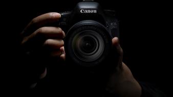 Black background cameras hands wallpaper