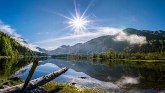 Sun blue skies clouds forests hills wallpaper
