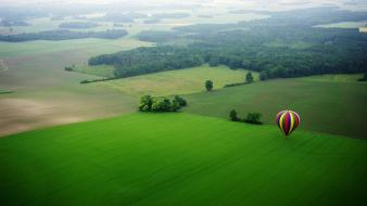 Grass green hot air balloons spring wallpaper