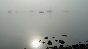Water rocks fog boats reflections wallpaper