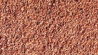 Close-up peanuts background chopped nuts wallpaper