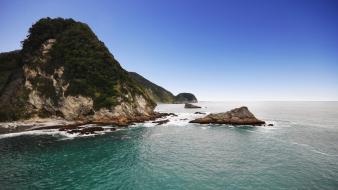 Hills rocks reef new zealand skyscapes sea wallpaper
