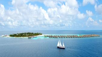 Sailboats cruise sea beach wallpaper