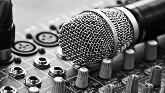 Close-up grayscale microphones music studio wallpaper